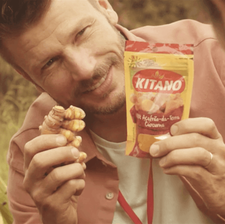 Close up photo of Rodrigo holding a Kitano package and ginger in his hand